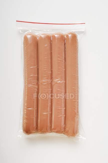 Raw Frankfurters in packaging — Stock Photo