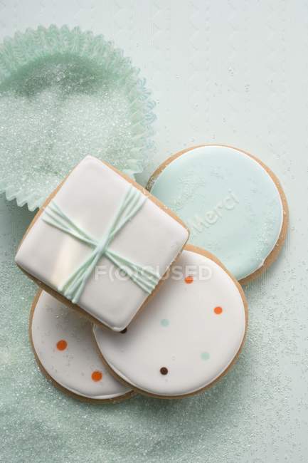 Biscuits and pastel-coloured sugar — Stock Photo
