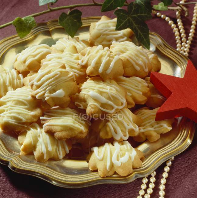 Piped Christmas biscuits — Stock Photo