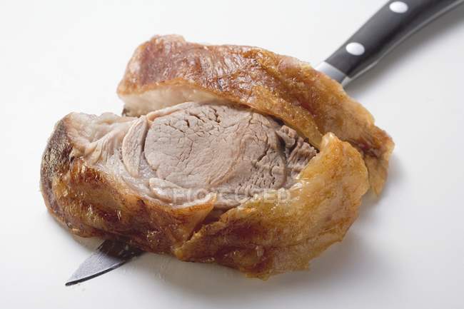 Slice of roasted shoulder of lamb — Stock Photo