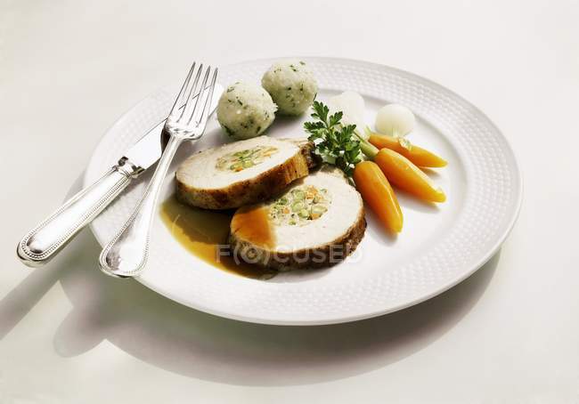 Stuffed loin of pork with herb dumplings — Stock Photo