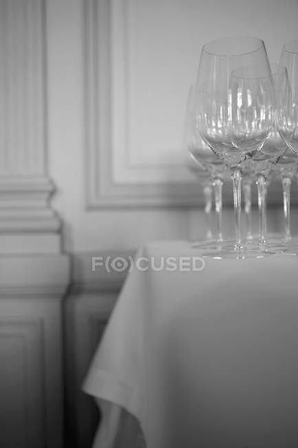 Stemmed wine glasses on a restaurant table — Stock Photo