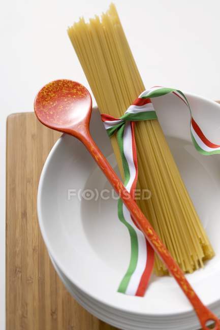 Spaghetti with cooking spoon — Stock Photo