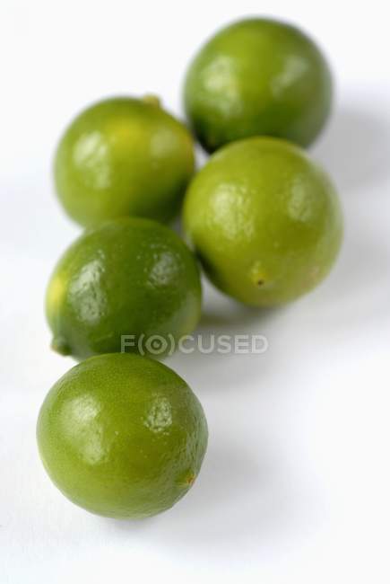 Five green limequats — Stock Photo