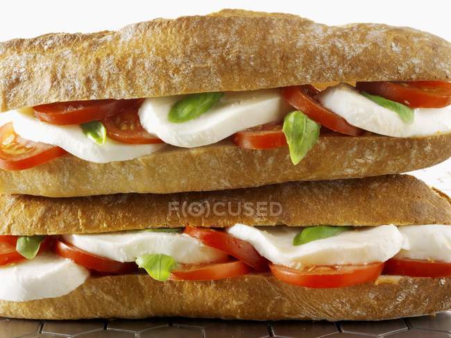 Mozzarella and tomato baguettes — Stock Photo