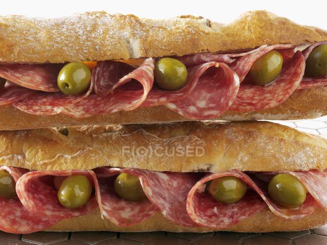 Two salami and olive baguettes — Stock Photo