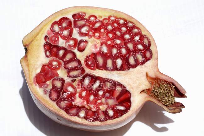 Half ripe pomegranate — Stock Photo