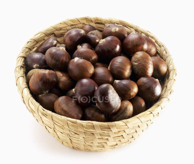 Sweet chestnuts in a basket — Stock Photo