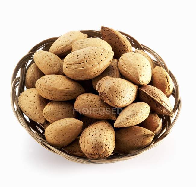 Shelled Almonds in basket — Stock Photo