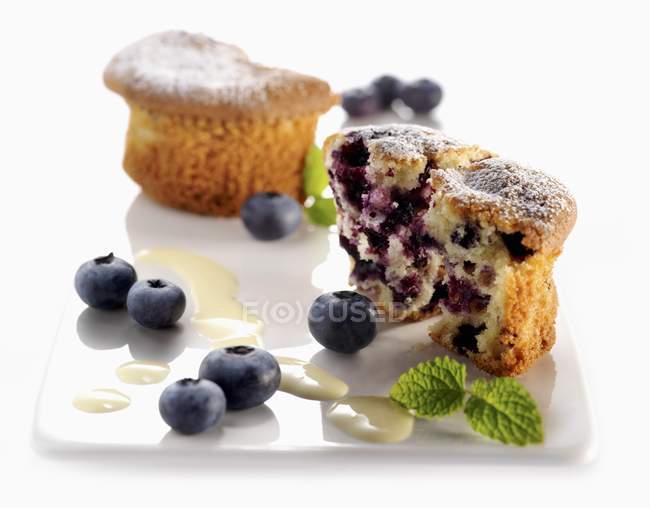 Blueberry halved muffin on plate — Stock Photo