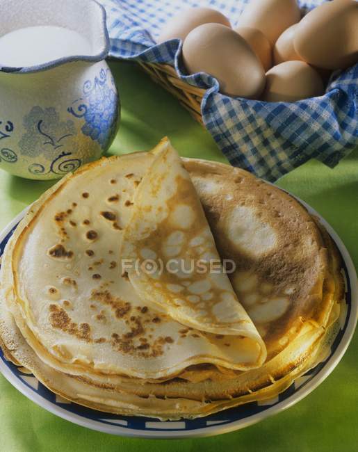 Pancakes, eggs and milk — Stock Photo