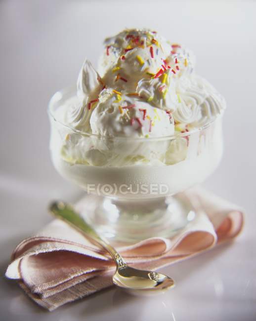 Cream and sprinkles in sundae — Stock Photo