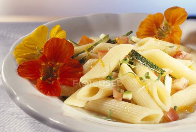 Penne pasta with flowers — Stock Photo