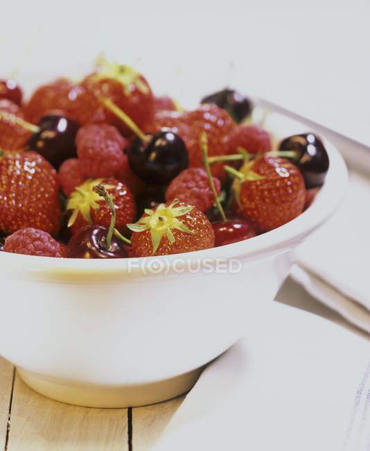 Strawberries in white bowl — Stock Photo