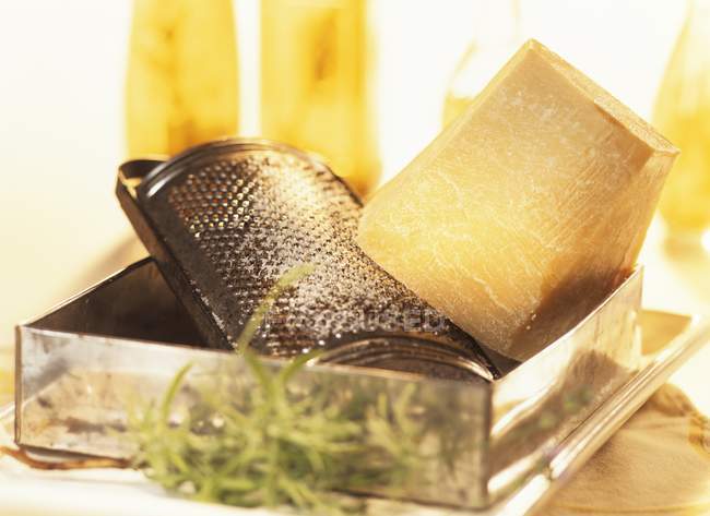 Parmesan with cheese grater — Stock Photo