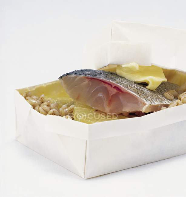 Sea bass with butter and lemon — Stock Photo