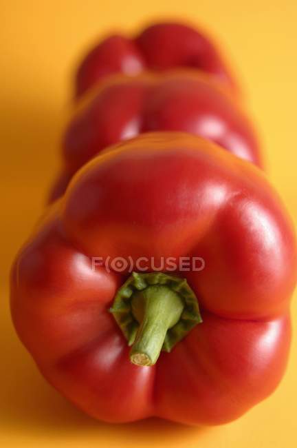 Three red bell peppers — Stock Photo