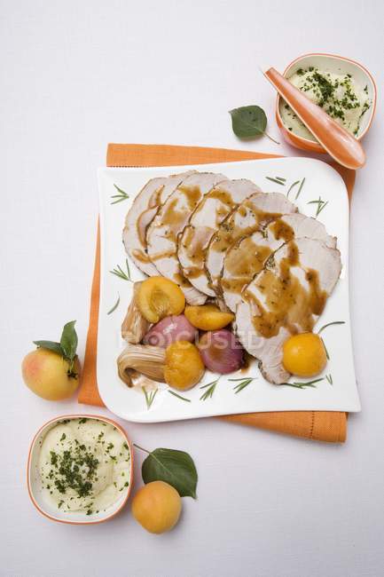 Roast pork with apricots — Stock Photo