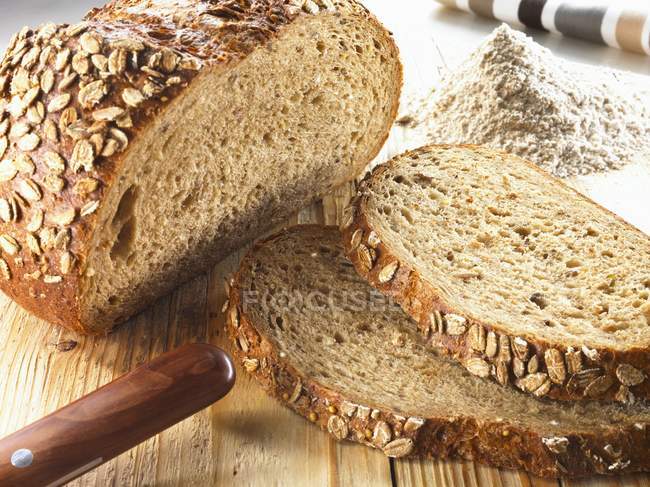 Partly sliced Organic rye bread — Stock Photo