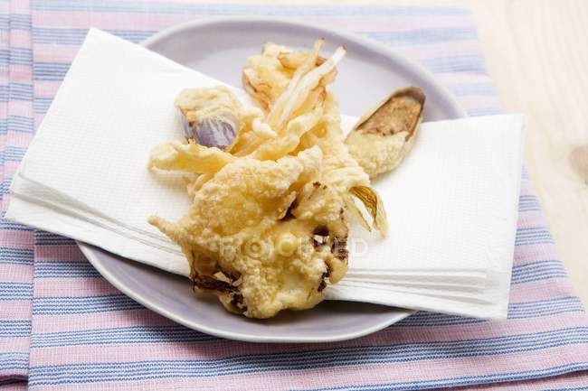 Vegetable tempura on plate with towel — Stock Photo