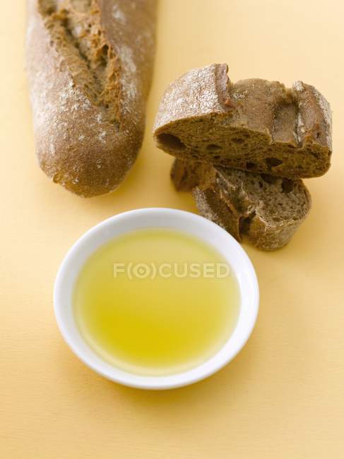 Partly sliced Rye baguette — Stock Photo