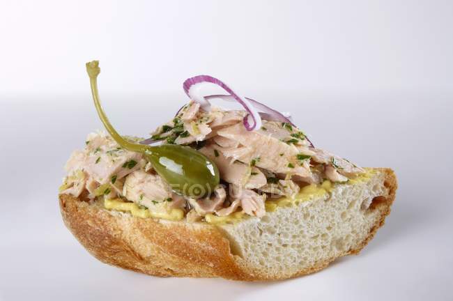 Baguette topped with tuna — Stock Photo