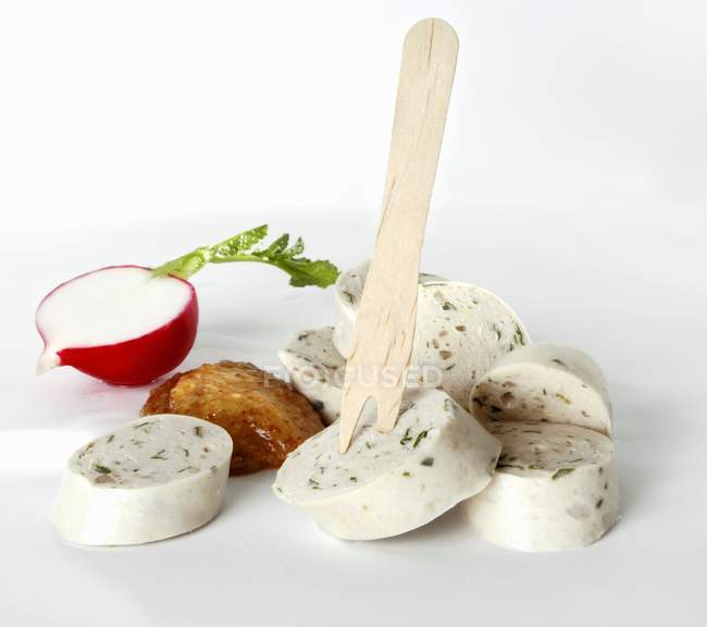 Weisswurst - white sausage, wooden fork, mild mustard and radish on white background — Stock Photo