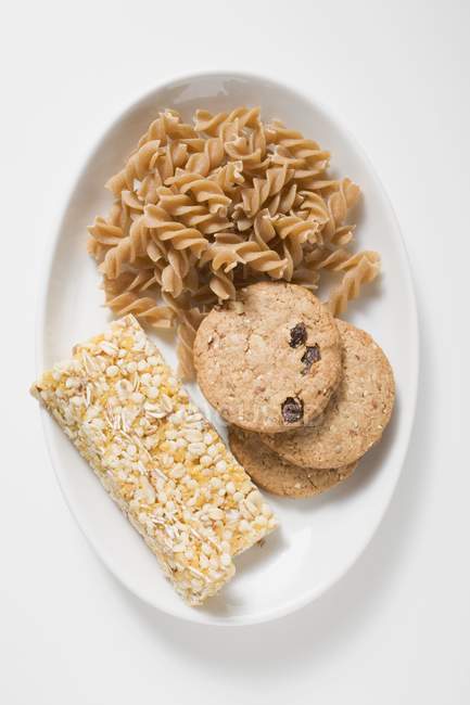 Wholemeal biscuits, pasta and muesli — Stock Photo