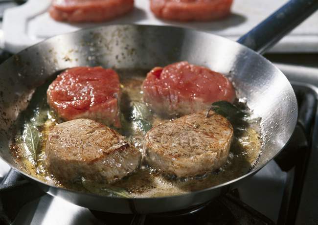 Frying veal medallions — Stock Photo