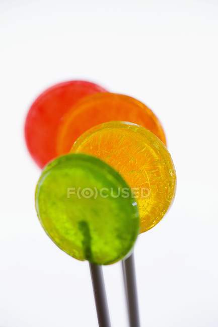 Four coloured lollipops — Stock Photo