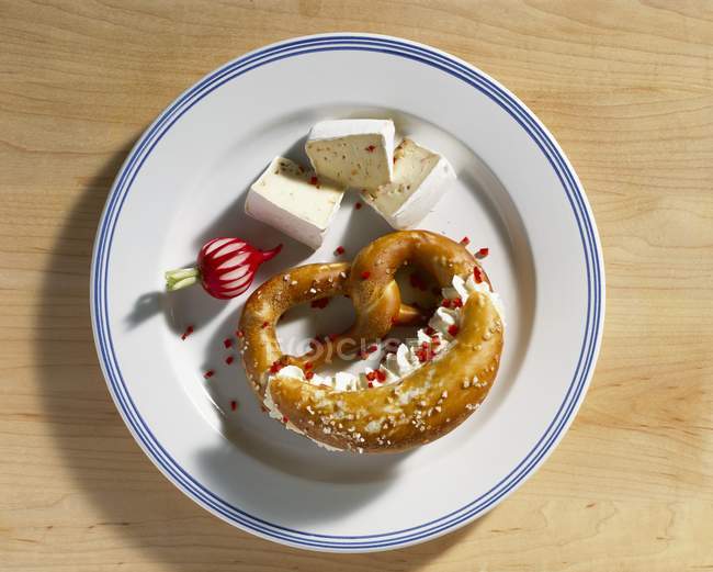 Pretzel filled with soft cheese — Stock Photo