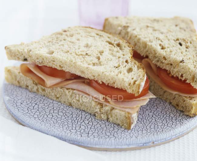 Ham and tomato sandwiches — Stock Photo
