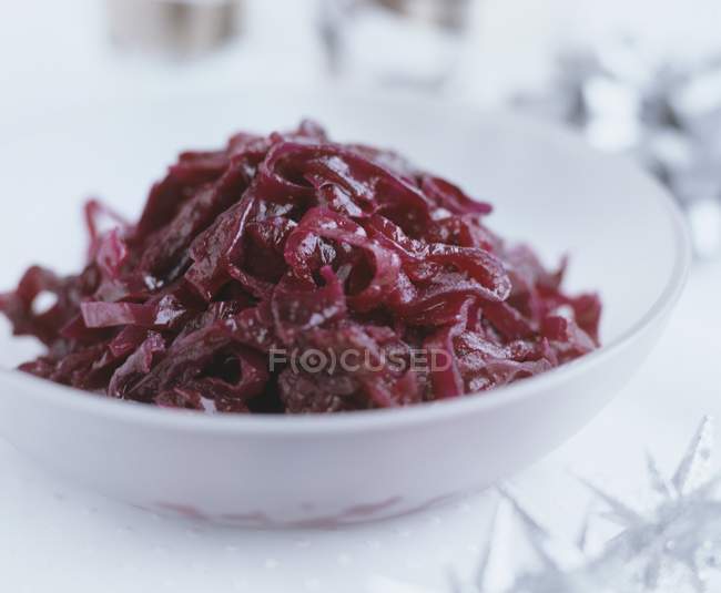Side dish of red cabbage over white surface — Stock Photo