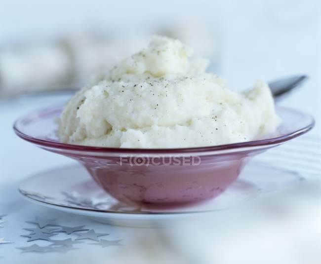 Celery puree with nutmeg in a dish over table — Stock Photo