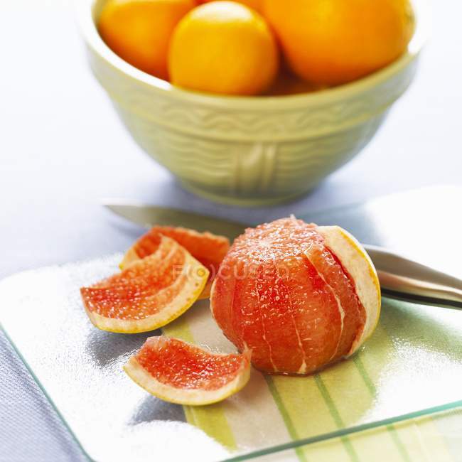 Peeled pink grapefruit — Stock Photo