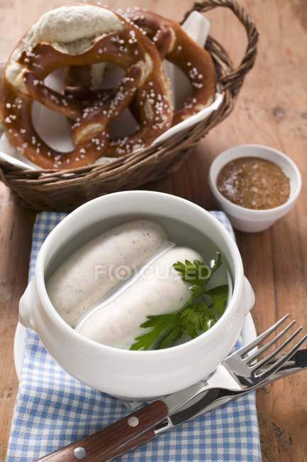 Two cooked Weisswurst in soup cup — Stock Photo