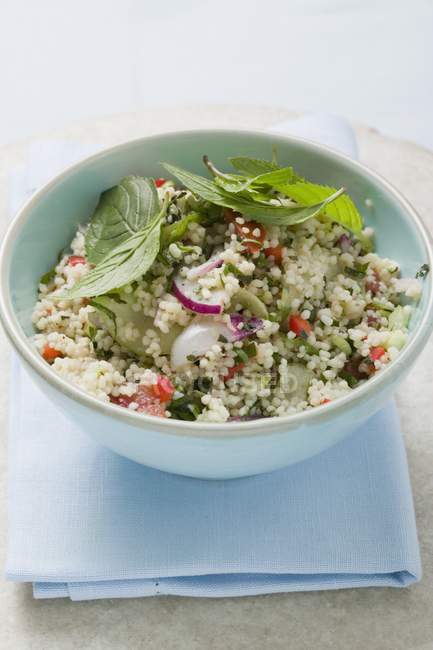 Couscous salad with vegetables and mint — Stock Photo