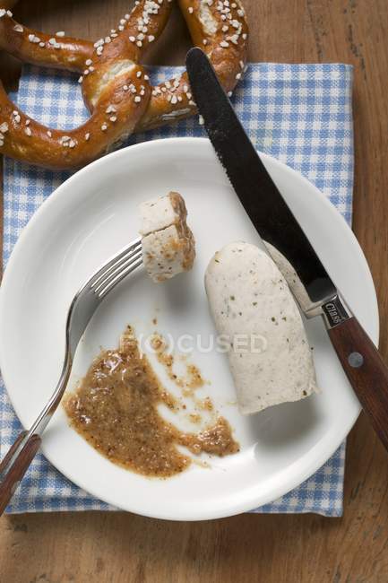 Weisswurst with mustard on plate — Stock Photo