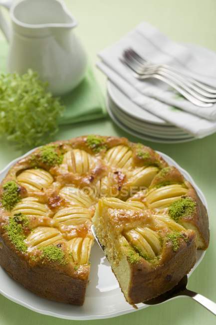 Apple cake with chopped pistachios — Stock Photo