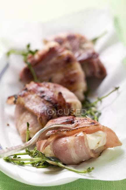 Goat's cheese wrapped — Stock Photo