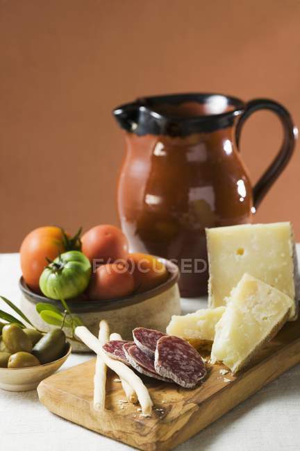 Tomatoes with olives and Parmesan — Stock Photo