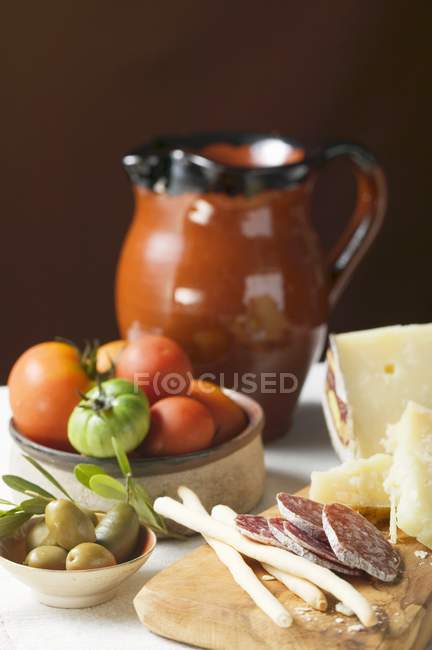 Tomatoes with olives and Parmesan — Stock Photo