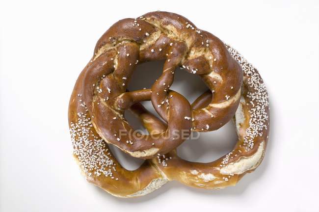 Salted pretzels on white background — Stock Photo