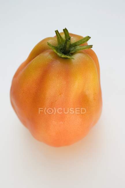 Fresh ripe yellow tomato — Stock Photo
