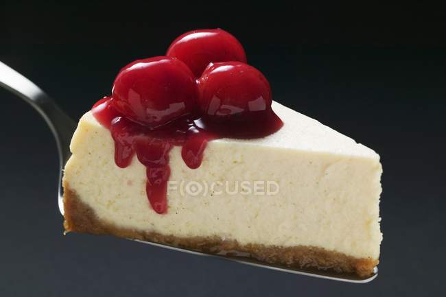 Slice of cheesecake with cherries — Stock Photo