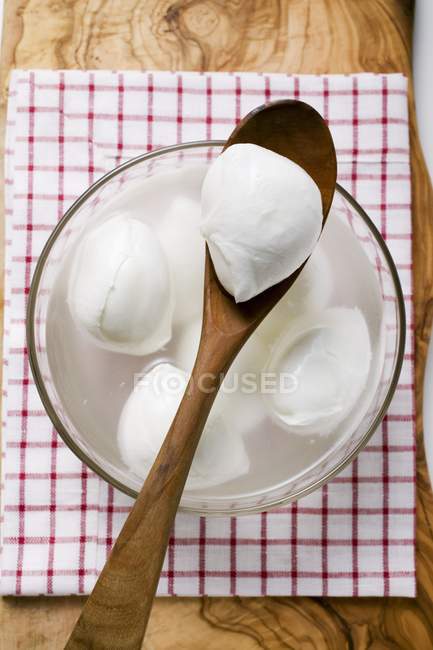 Mozzarella with brine in glass bowl — Stock Photo