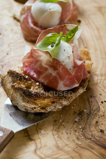 Crostini with Parma ham — Stock Photo
