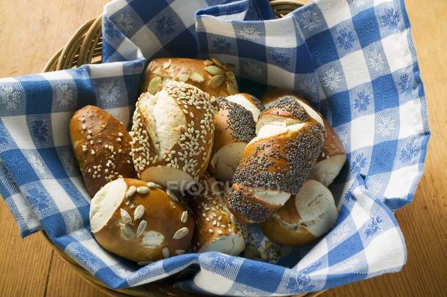 Assorted pretzel rolls in bread basket — Stock Photo
