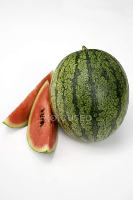Fresh watermelon with slices — Stock Photo
