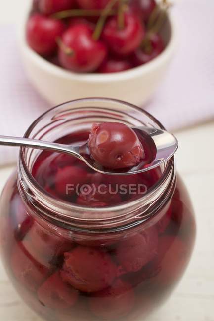 Cherry compote in jar — Stock Photo